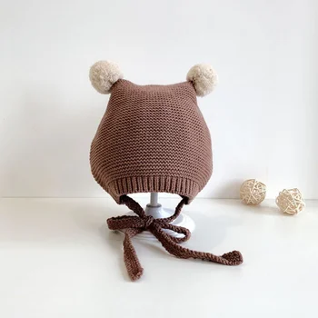 Обнимитесь в уютном стиле: теплые осенне-зимние детские шапочки-ушанки с очаровательными вставками из помпонов (3-18 месяцев)